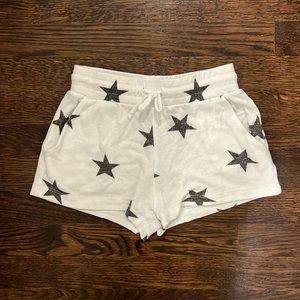 White shorts with blackish stars, pockets, & drawstring